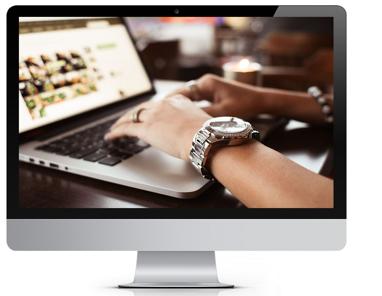 Computer Monitor with hands typing on a keyboard